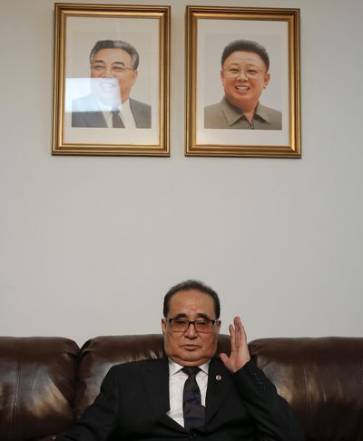 Seated under portraits of former North Korean Leaders Kim Il Sung, left, and Kim Jong Il, North Korea’s Foreign Minister Ri Su Yong answers questions during an interview Saturday at the country’s Permanent Mission to the United Nations in New York. (Julie Jacobson / Associated Press)