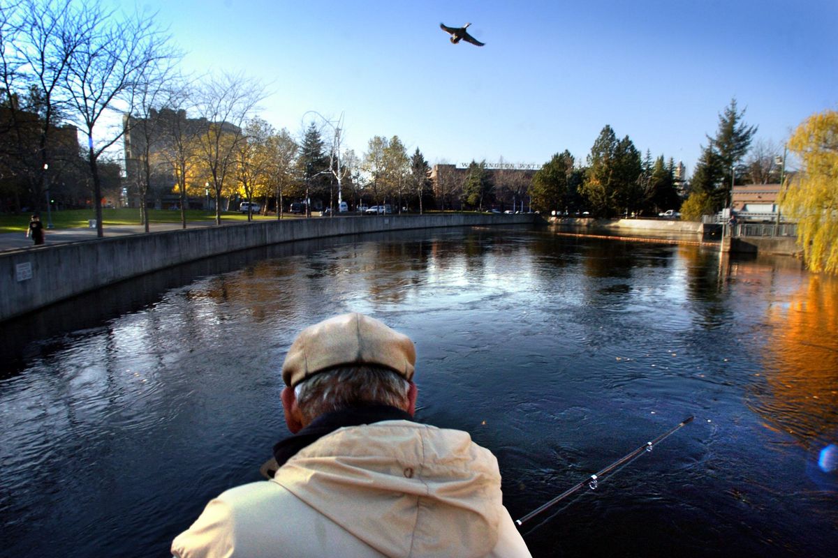 FILE - A fisherman tries his luck along Howard Street bridge in Riverfront Park in this undated photo. Fishing is allowed in city parks in rivers and creeks, but is prohibited in ponds. (Jed Conklin / The Spokesman-Review)
