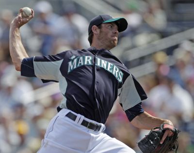 Seattle overcame starting pitcher Doug Fister’s early struggles to beat the Chicago Cubs 5-3 on Monday. (Associated Press)