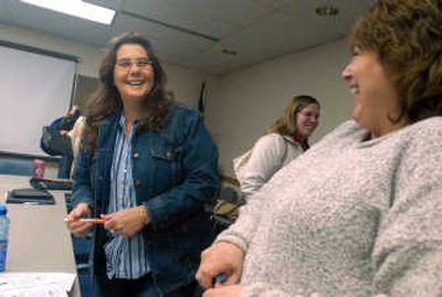 Kippy Jones, left, jokes with friends Cherie Moss, right, and Nikki Rabey after a meeting Wednesday at the East Central Community Center, where Jones is completing an internship for her degree at Spokane Falls Community College. 
 (Jesse Tinsley / The Spokesman-Review)