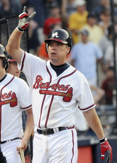 Braves’ Chipper Jones homered and drove in five runs in Atlanta’s 9-8 victory. (Associated Press)