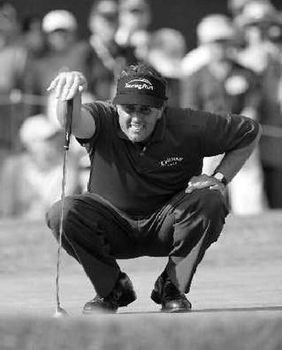 
Phil Mickelson eyes his putt on the 17th green of the Nissan Open on Saturday. 
 (Associated Press / The Spokesman-Review)