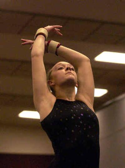 
U-Hi junior Kayla McGahey works on her beam exercise during practice. McGahey has won all-around honors in three GSL meets this season. 
 (Liz Kishimoto / The Spokesman-Review)
