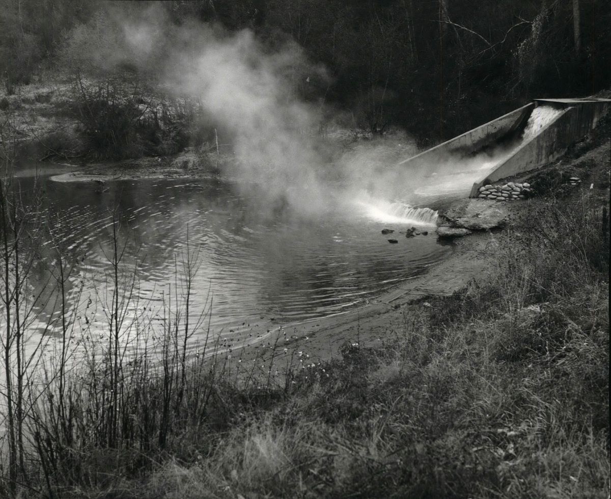The outfall from the nearby Kaiser Aluminum smelting plant into the Peone Creek swimming hole is seen here in a photo taken Nov. 20, 1970. County officials said when dedicating the park that the water that flowed into the creek was of the same quality as the creek water, based on available tests at the time.  (The Spokesman-Review photo archive)