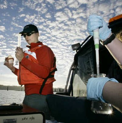 
Mindy Roberts, left, a project manager with Washington state's Dept. of Ecology, takes a water sample from Budd Inlet in Puget Sound on Oct. 22. Associated Press
 (Associated Press / The Spokesman-Review)