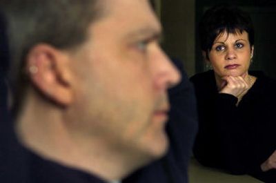
Wendy Darnold looks at her boyfriend of seven years, Barry Lehinger, in the apartment they share. Darnold has taken care of Lehinger since a brain injury two years ago took parts of his memory. 
 (Holly Pickett / The Spokesman-Review)