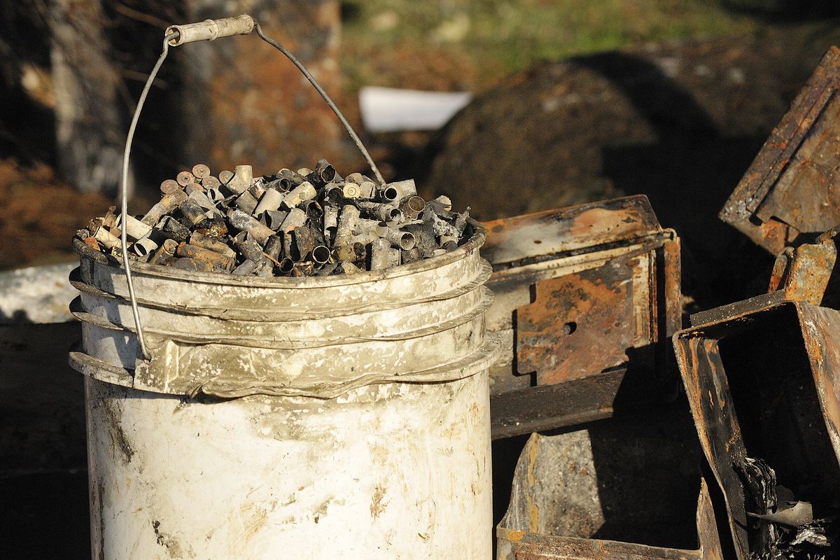 Shell casings sit near the property of Steven D. Stanbary on Friday as investigators continue their work in the case in Washougal, Wash. (Associated Press)