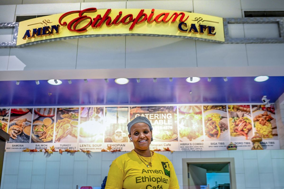 Amen Ethiopian Café owner Hibra Tsegay is photographed on Nov. 11 in the Spokane Valley Mall Food Court.  (Kathy Plonka/The Spokesman-Review)