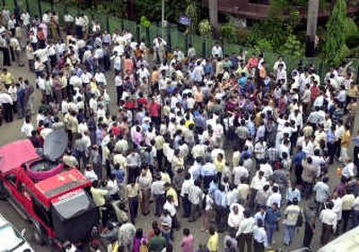 
Indian investors and stockbrokers gather outside the Bombay Stock Exchange after the market was suspended for two hours in Bombay, India, Monday. India's stock market recorded the biggest plunge in its 129-year history.Indian investors and stockbrokers gather outside the Bombay Stock Exchange after the market was suspended for two hours in Bombay, India, Monday. India's stock market recorded the biggest plunge in its 129-year history.
 (Associated PressAssociated Press / The Spokesman-Review)