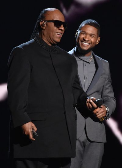 Stevie Wonder, left, and Usher perform at the 57th annual Grammy Awards in Los Angeles. (John Shearer/Invision/AP)