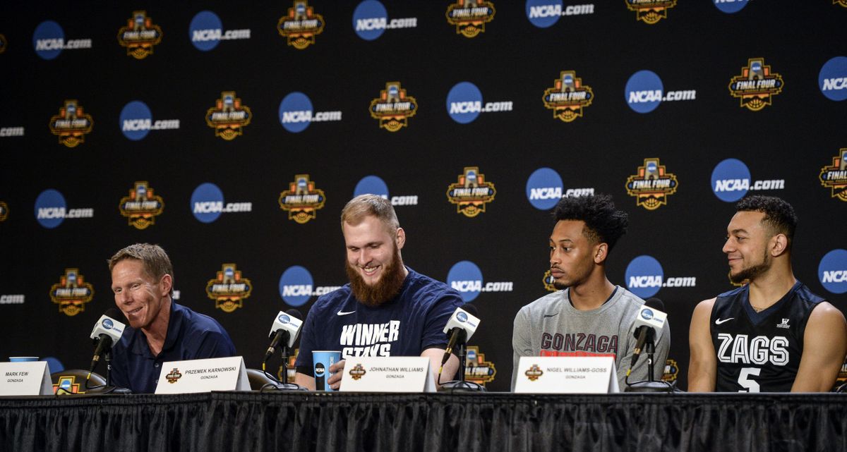 Gonzaga coach Mark Few, left, and players Przemek Karnowski, Johathan Williams and Nigel Williams-Goss keep things light at at a press conference, Sunday, April 2, 2017, in Phoenix. The Zags wil battle North Carolina for the national championship on Monday evening. (Dan Pelle / The Spokesman-Review)