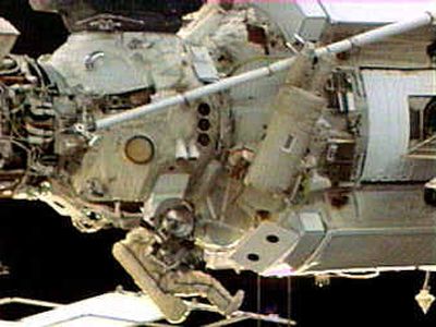 
Expedition 9 Commander Gennady Padalka rests under the Zarya module of the International space station as astronaut Mike Fincke rests upside down under the Strela boom during a televised spacewalk on Wednesday.Expedition 9 Commander Gennady Padalka rests under the Zarya module of the International space station as astronaut Mike Fincke rests upside down under the Strela boom during a televised spacewalk on Wednesday.
 (Associated Press / The Spokesman-Review)