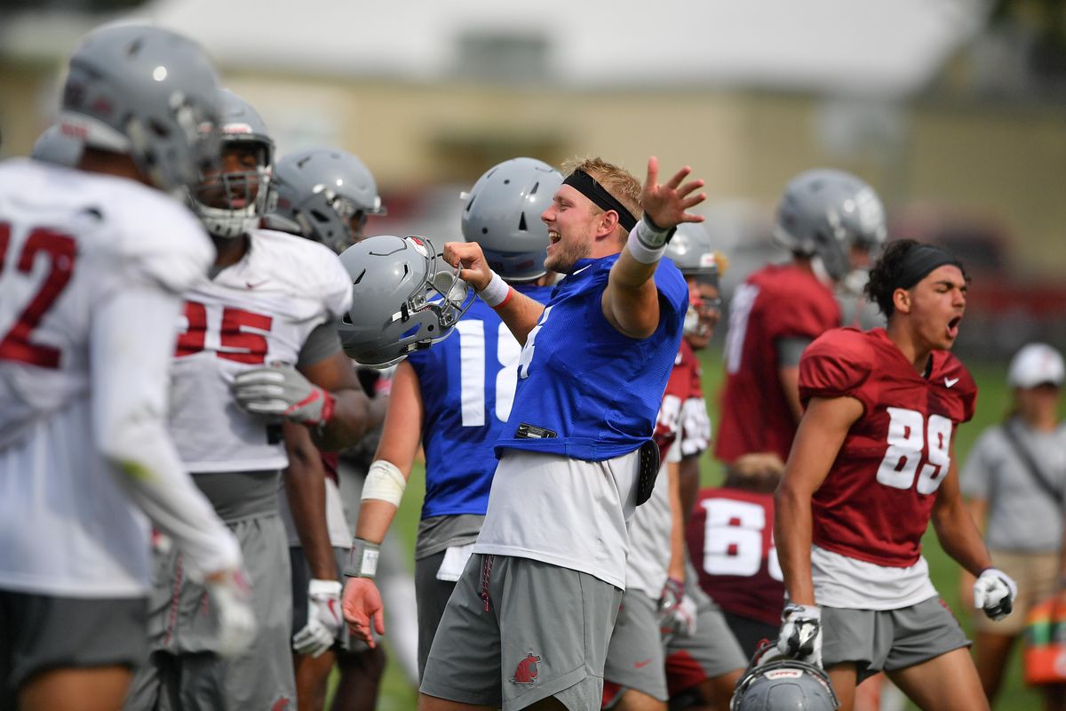 Washington State Cougars quarterback Gage Gubrud (4) celebrates with teammates during a practice on Wednesday, August 7, 2019, at Sacajawea Jr. High School in Lewiston, ID. (Tyler Tjomsland / The Spokesman-Review)