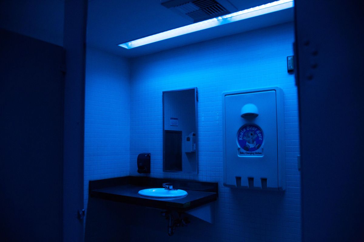 Blue fluorescent lights have recently been installed in the men’s bathrooms in the Downtown Spokane Public Library. The lights are seen from an empty first floor men’s bathroom on Wednesday, March 20, 2019. (Libby Kamrowski / The Spokesman-Review)