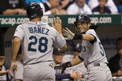 
Ichiro Suzuki, right, congratulates Raul Ibanez.Associated Press
 (Associated Press / The Spokesman-Review)