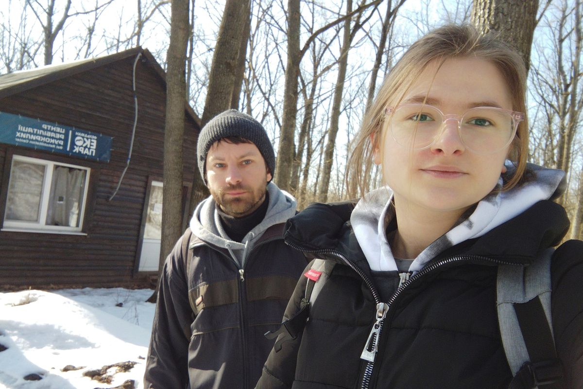 This March 2022 photo provided by Alona Shulenko shows her, right, and fellow zoologist Anton Vlaschenko outside the Feldman Ecopark area outpost of the Ukrainian Bat Rehabilitation Center in Kharkiv, Ukraine. “Our staying in Ukraine, our continuing to work – it’s some kind of resistance of Russian invasion,” Vlaschenko said via Zoom, a barrage of shelling audible in the background. “The people together in Ukraine are ready to fight, not only with guns. We don’t want to lose our country.”  (Alona Shulenko)