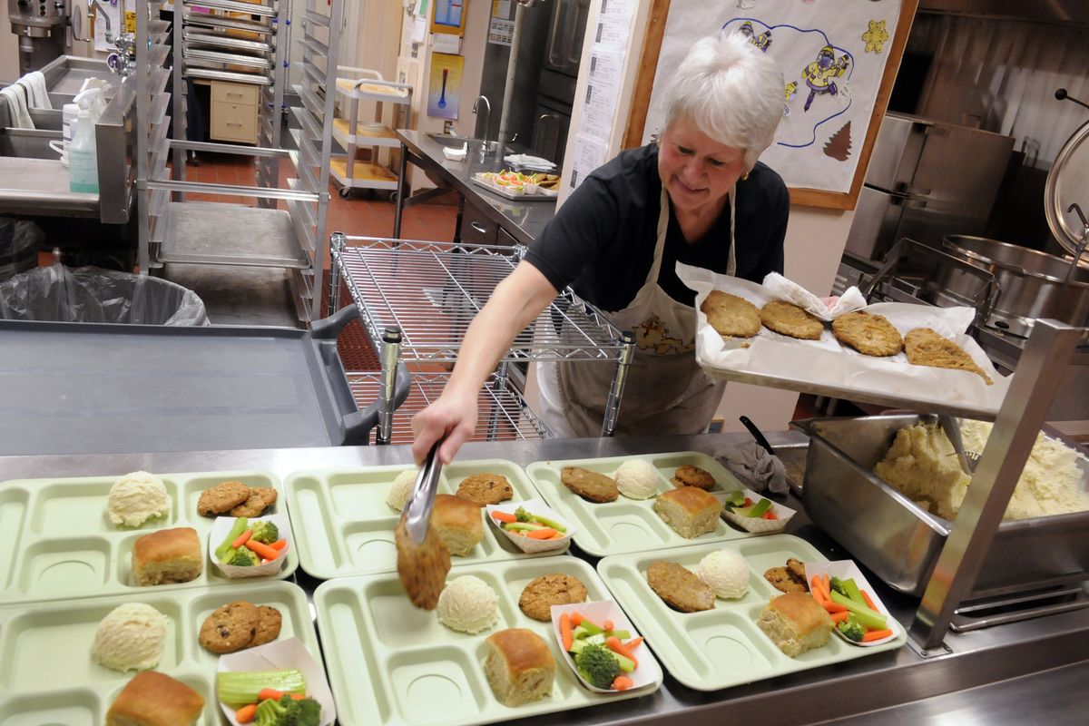 Otis Orchards Elementary kitchen manager Judy Boykin serves up chicken fried steak wth potatoes and gravy, vegetables, rolls and cookies for the senior meals lunch Feb. 3. Lunch through Valley Meals on Wheels is offered Tuesdays and Thursdays at 12:30 p.m. (J. Bart Rayniak / The Spokesman-Review)