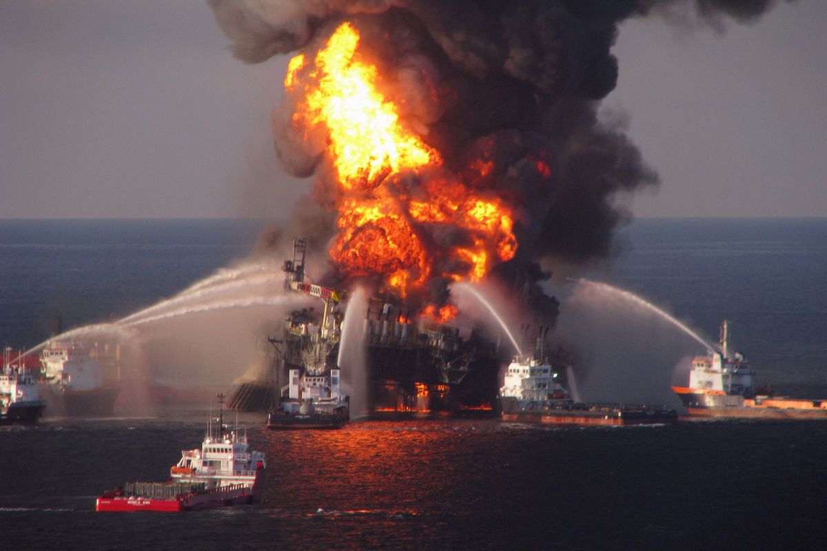   In a photo from the U.S. Coast Guard, ships spray water on the burning Deepwater Horizon oil rig in the Gulf of Mexico, April 21, 2010. The Department of Interior announced on Aug. 22, 2023, that it had reinstated Obama-era safety rules for offshore drilling that were created in the wake of the 2010 Deepwater Horizon catastrophe that killed 11 people and fouled the Gulf of Mexico.    (U.S. COAST GUARD)