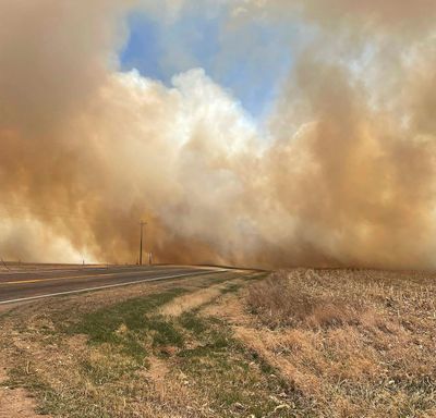 This image provided by the Nebraska State Patrol shows smoke from a wildfire, Saturday, April 23, 2022 near Cambridge, Neb. Several small towns, including Cambridge, Bartley, Indianola and Wilsonville, in Nebraska's southwest and Macy in its northeast, were forced to temporarily evacuate because of the wind-driven wildfires.  (HOGP)