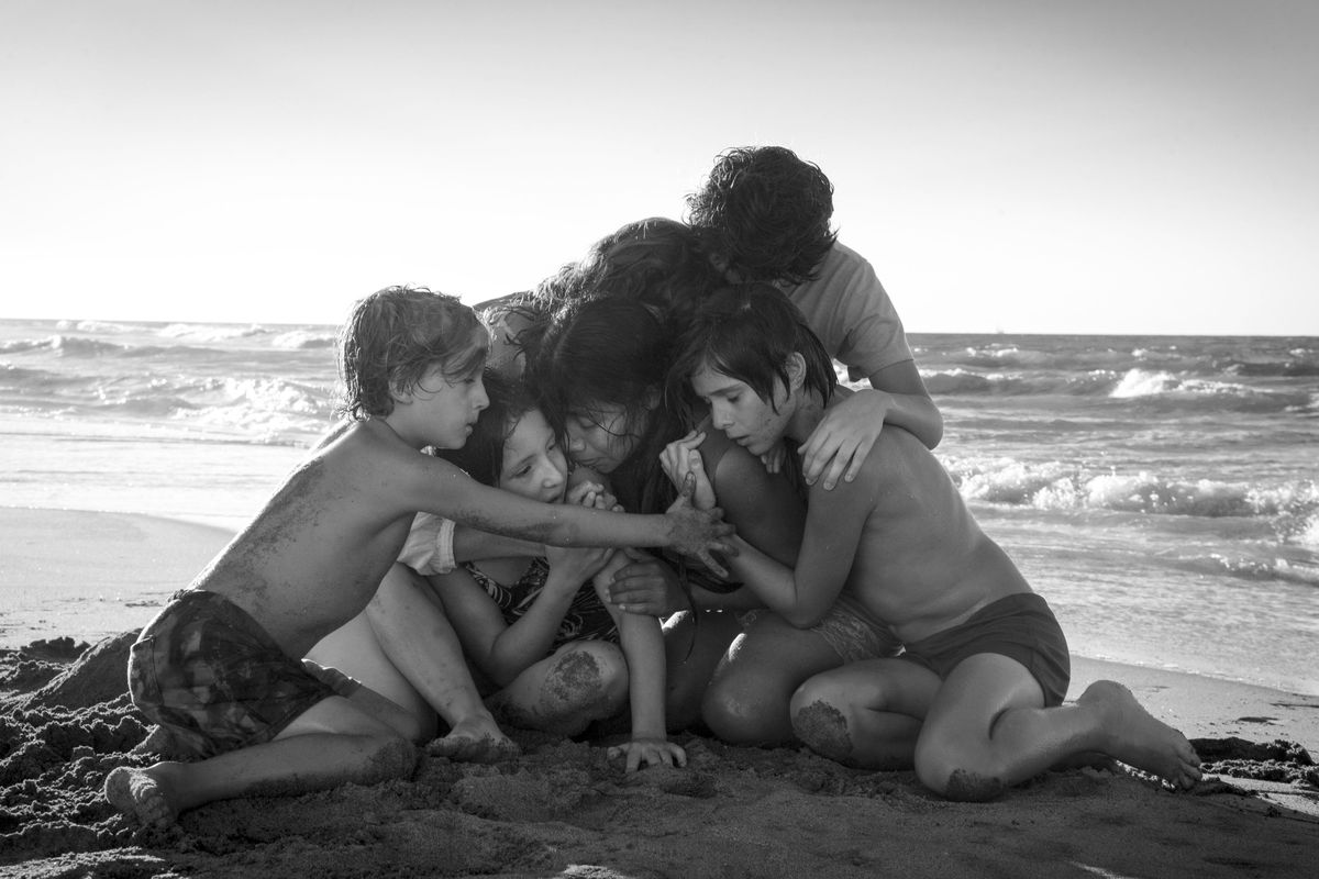 This image released by Netflix shows Yalitza Aparicio, center, in a scene from the film "Roma," by filmmaker Alfonso Cuaron. On Tuesday, Jan. 22, 2019, the film was nominated for an Oscar for both best foreign language film and best picture. The 91st Academy Awards will be held on Feb. 24. (Carlos Somonte/Netflix / Associated Press)