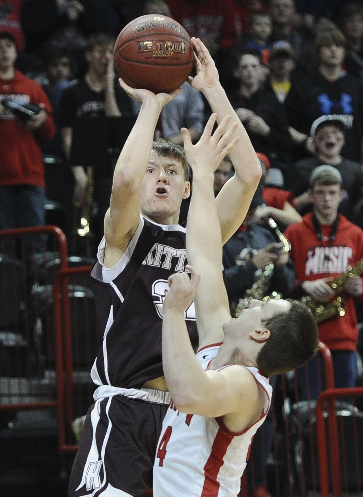 Kittitas guard Brock Ravet shoots over a Liberty defender in the State 2B championship game at the Spokane Arena. (Tyler Tjomsland / The Spokesman-Review)