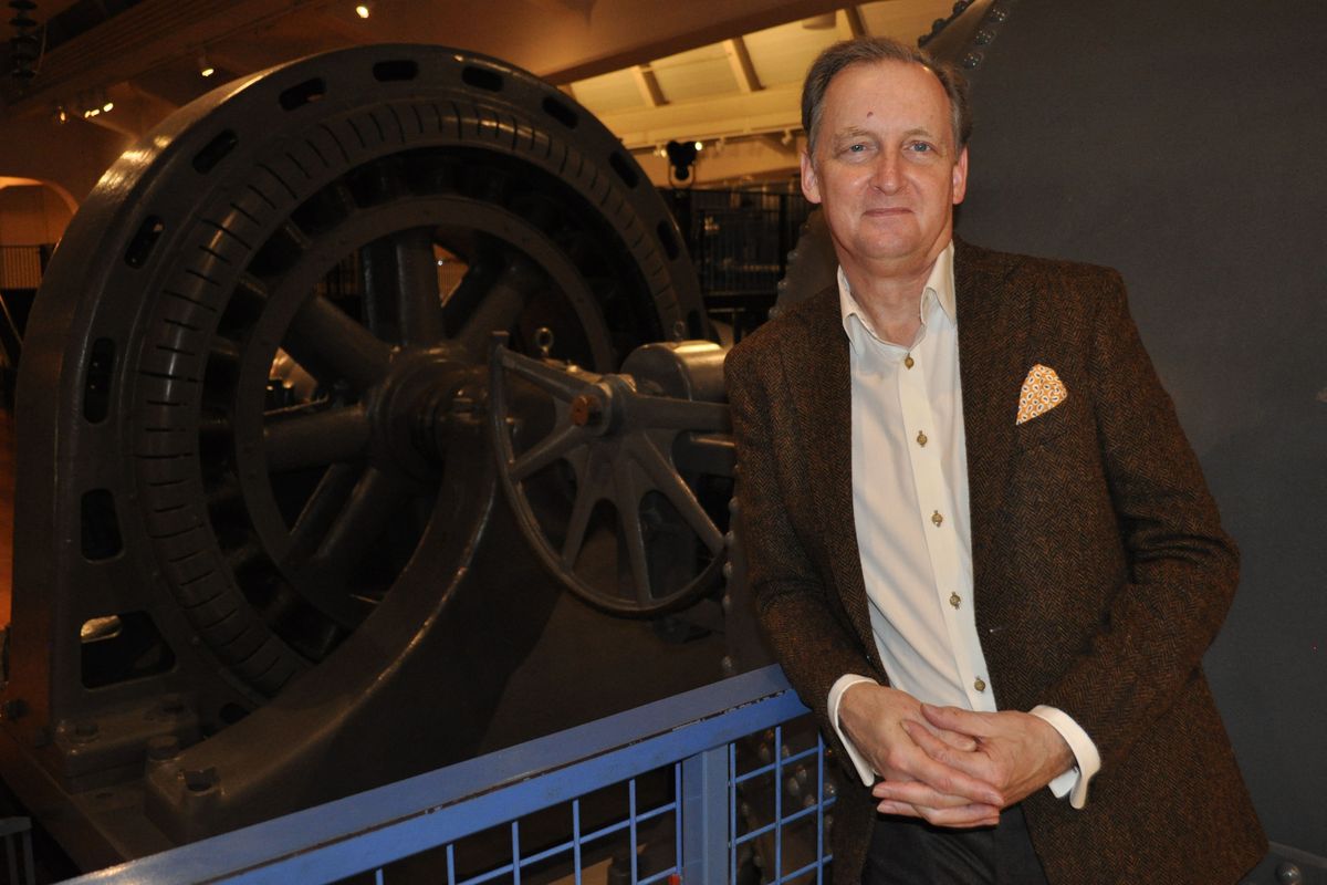 J. Marc Greuther, vice president of historical resources and chief curator of the Henry Ford Museum of American Innovation in Dearborn, Mich., stands Jan. 2 in front of a generator attached to a water turbine built in 1903 and used in the Monroe Street Dam in downtown Spokane until it was removed in 1990 and shipped to the museum. The turbine is on display in the museum’s “Made in America” exhibit. Greuther was involved in the project to restore it as a museum piece.  (JONATHAN BRUNT/THE SPOKESMAN-REVIEW)