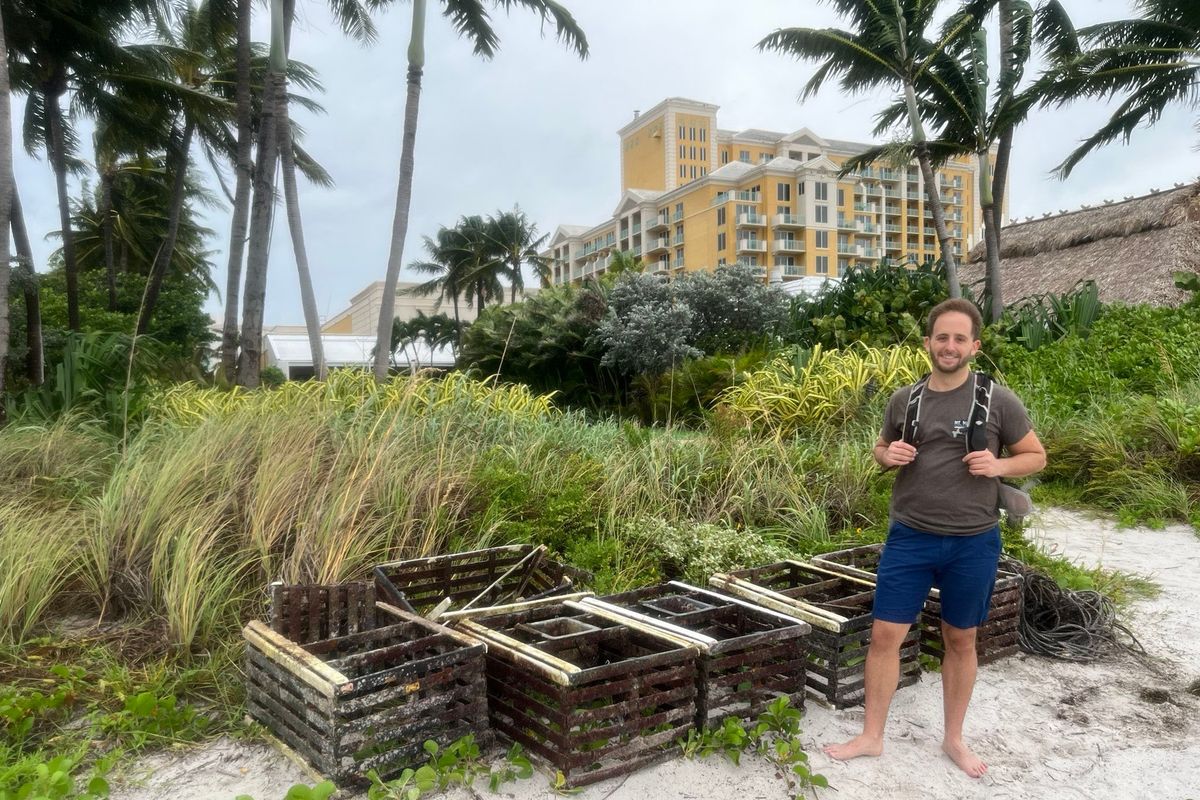 Andrew Otazo, 35, with the lobster traps he, Manny Rionda and two strangers piled up at Key Biscayne Beach, Fla.  (Manny Rionda/Handout)