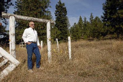 
Architect Stan Huffaker stands on a hillside in the Fernan area of Coeur d'Alene where he and partners plan a multifamily housing project. 
 (Jesse Tinsley / The Spokesman-Review)