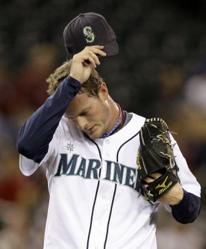 Seattle reliever Mark Lowe cools down after allowing three runs in the seventh inning.  (Associated Press / The Spokesman-Review)