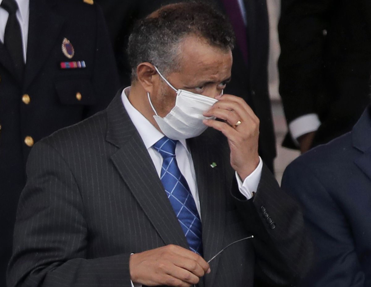 FILE - In this file photo dated Tuesday, July 14, 2020, Director General of the World Health Organization, Tedros Adhanom Ghebreyesus, adjusts his face mask during the Bastille Day military parade, in Paris. France. More than 20 heads of government and global agencies have called for an international treaty for pandemic preparedness and response, that they say will protect future generations from future pandemics, with WHO