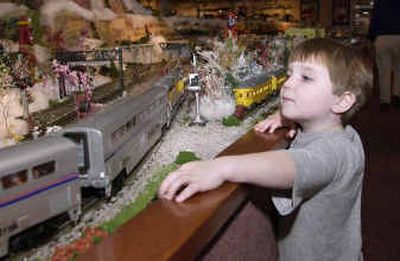 
Andrew Kekel, 3, plays with the switches on the train display at Lionel in Chesterfield Township, Mich., last week. 
 (Associated Press / The Spokesman-Review)