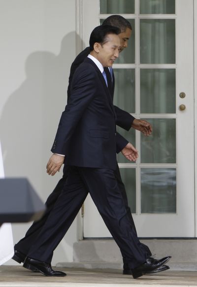 South Korean President Lee Myung-Bak and President Barack Obama walk after a news conference at in the Rose Garden of the White House on Tuesday.  (Associated Press / The Spokesman-Review)