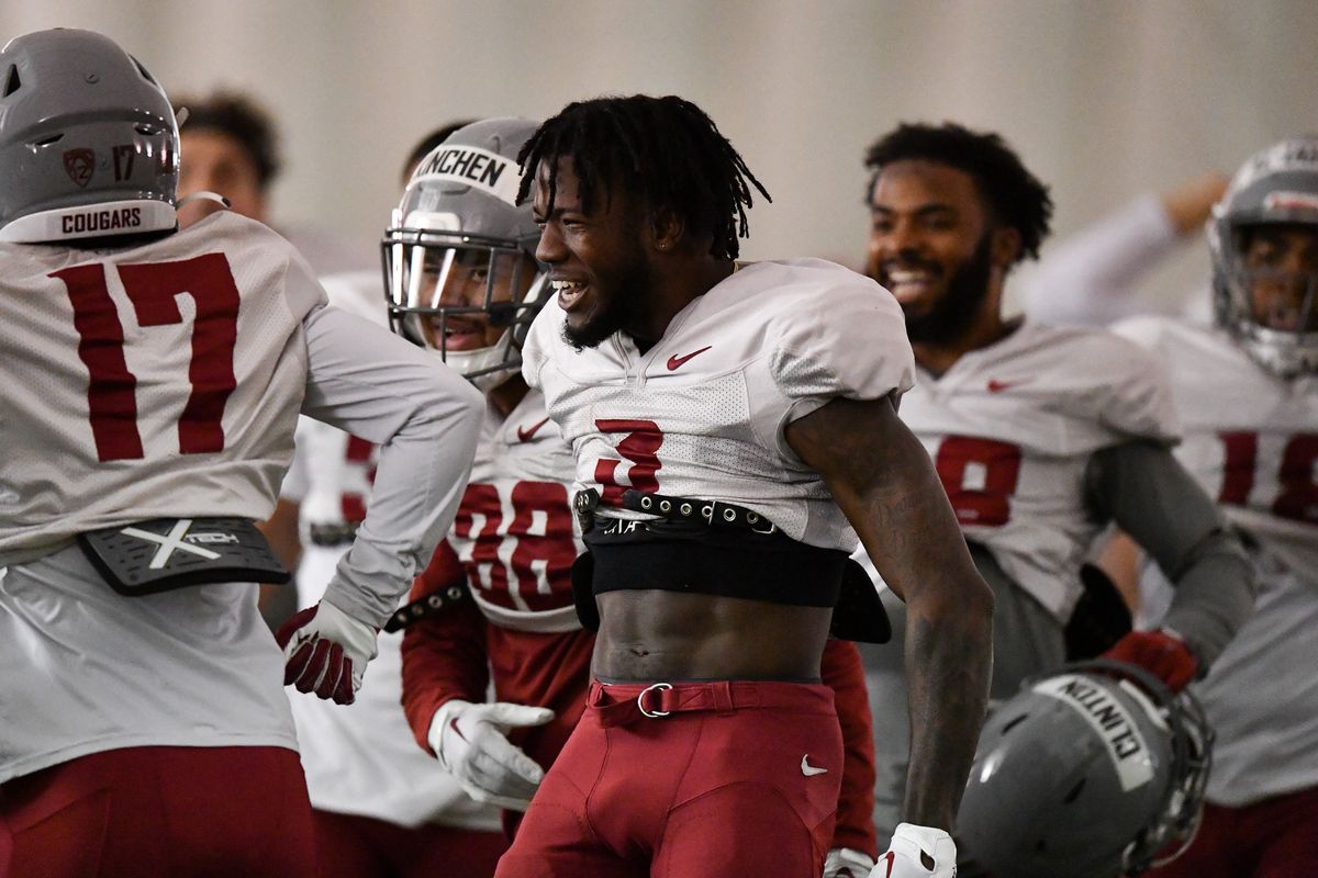 Washington State cornerback Cam Lampkin (3) is all smiles after the defense came away with an interception during a scrimmage April 1 at WSU’s indoor practice facility in Pullman.  (Tyler Tjomsland/The Spokesman-Review)