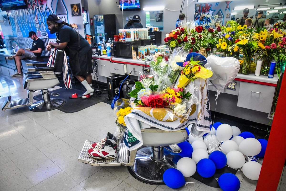 A memorial has sprung up at Exclusive Barbershop, Tuesday, July 27, 2021, for Daniel Martinez, who died after his friend allegedly shot him at Ichabod