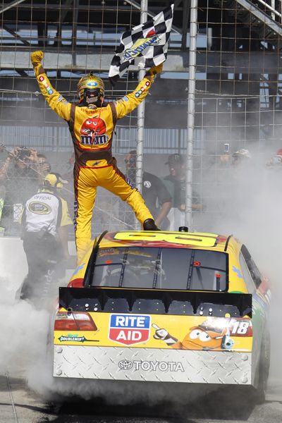 Kyle Busch celebrates after winning the Autism Speaks 400 Sunday at Dover, Del.  (Associated Press)