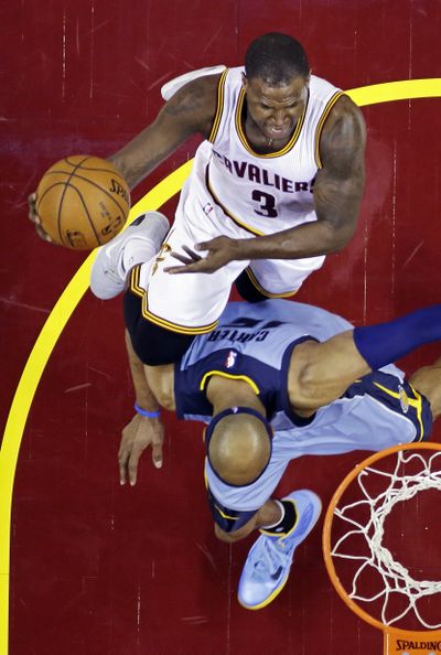 Cleveland’s Dion Waiters shoots over Memphis’ Vince Carter in the fourth quarter. Waiters scored 21 points off the bench. (Associated Press)