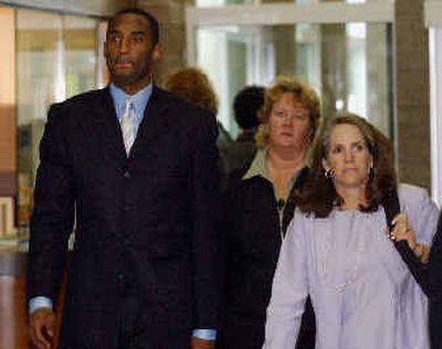 
 Kobe Bryant arrives at the Eagle County Courthouse with his defense attorney Pamela Mackey, right, and a member of his security team, Kym Stewart, center, on June 21. 
 (File/Associated Press / The Spokesman-Review)