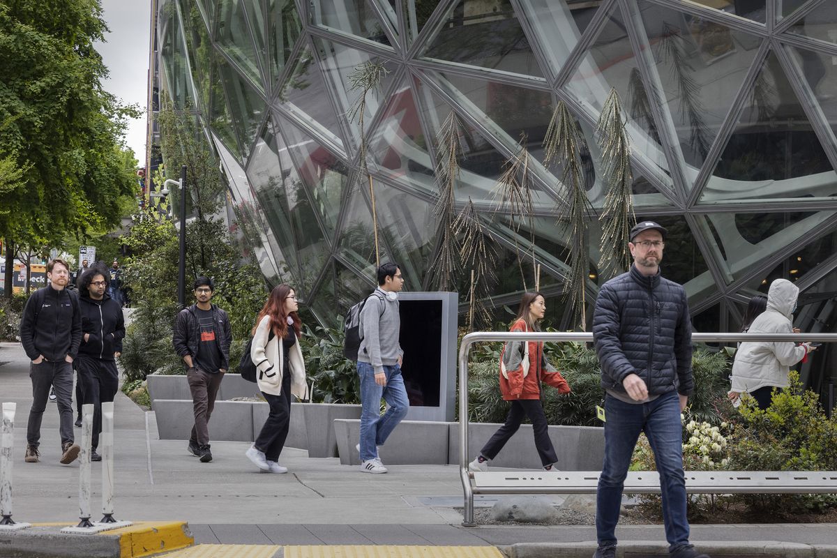 Foot traffic is fairly heavy in front of the Amazon spheres located at Lenora Street and Seventh Avenue in Seattle around noon Monday. (Seattle Times)