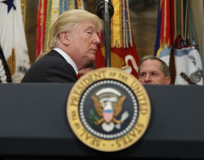 President Donald Trump listens to a question as he leaves a signing ceremony for the National Defense Authorization Act for Fiscal Year 2018, in the Roosevelt Room of the White House, Tuesday, Dec. 12, 2017, in Washington. (Evan Vucci / Associated Press)