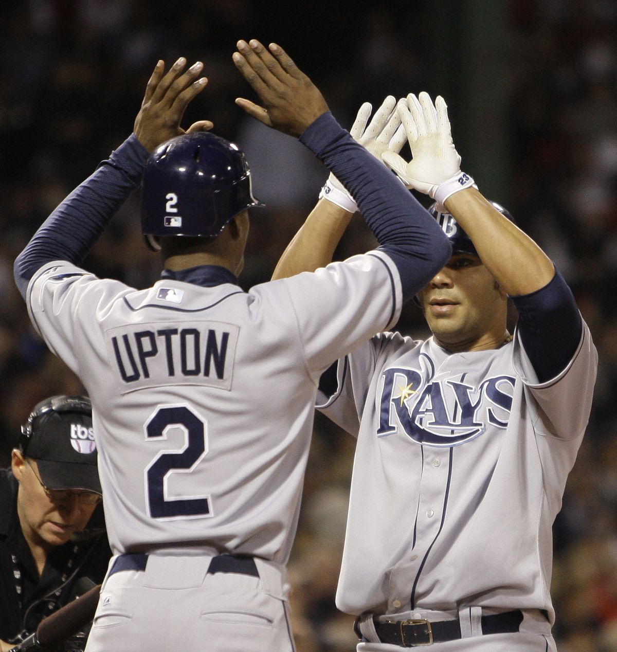 Rays’ B.J. Upton greets Carlos Pena after Pena’s home run.  (Associated Press / The Spokesman-Review)