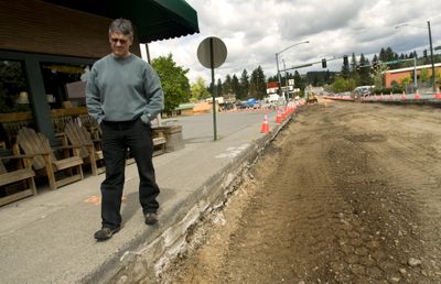 Argonne Road is constricted to one lane in each direction through the Millwood business area, where business owners such as  Rocket Bakery’s Jeff Postlewait are seeing a downturn in business.  The construction season is moving into high gear this month. (Colin Mulvany / The Spokesman-Review)