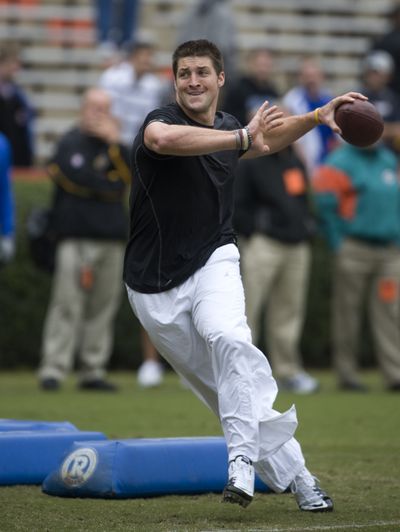 Tim Tebow impressed scouts, coaches and general managers with workout.  (Associated Press)