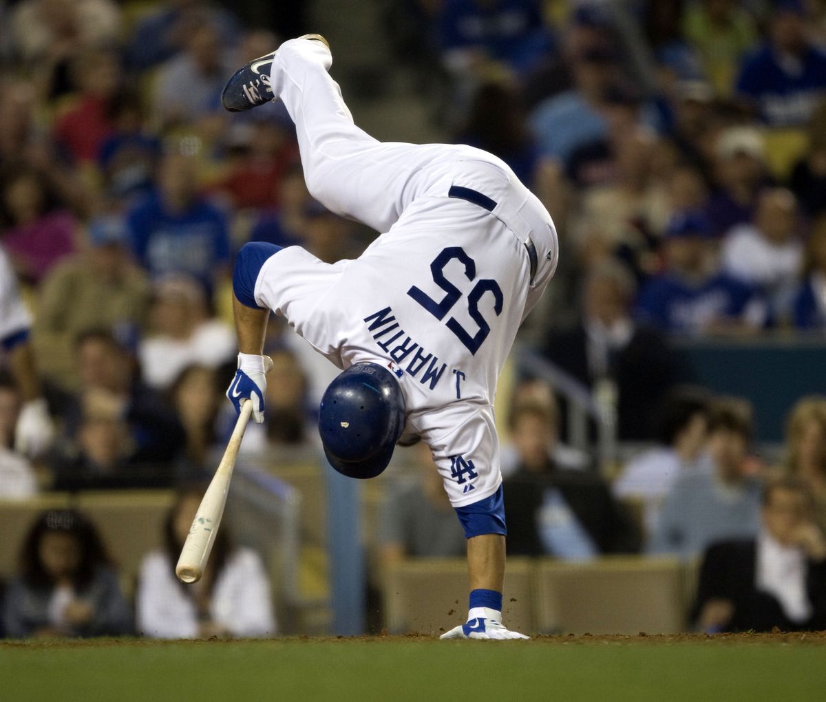 Russell Martin of the Dodgers avoids being hit by a pitch in the sixth inning against the Mariners.  (Associated Press / The Spokesman-Review)