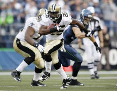 
New Orleans' Reggie Bush found enough holes in Seattle's defense to gain 97 yards rushing and 44 receiving.Associated Press
 (Associated Press / The Spokesman-Review)