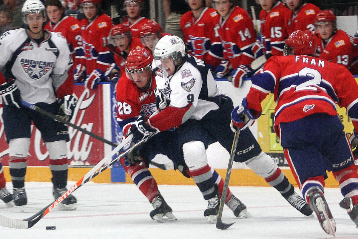 Chiefs’ Jackson Playfair (28) fights Tri-City’s Lucas Nickles for the puck in the Spokane end during the second period. (RICHARD DICKIN)