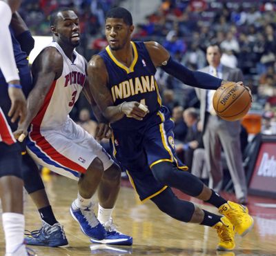 Indiana’s Paul George, who had 31 points in 99-91 win, drives past Detroit’s Rodney Stuckey. (Associated Press)