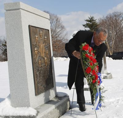 NASA Administrator Charles Bolden places a wreath at a Challenger memorial at Arlington National Cemetery  on Thursday. (Associated Press)