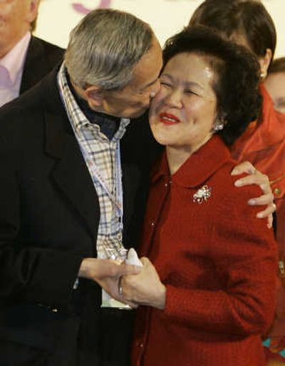 
Anson Chan is kissed by her husband, Archie Chan, today after winning in legislative by-elections in Hong Kong. Associated Press
 (Associated Press / The Spokesman-Review)