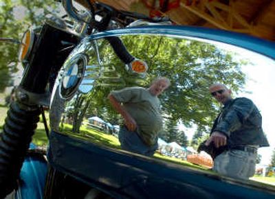 
Alex Shaffer, right, admires the 1972 BMW motorcycle of Colin Thomas, left, at the North Idaho Budweiser Motorcycle Show and Sale on Saturday in Rathdrum. Saturday was full of events in conjunction with Rathdrum Days, including a car show, parade, food booths and various contests.
 (Photos by JESSE TINSLEY / The Spokesman-Review)