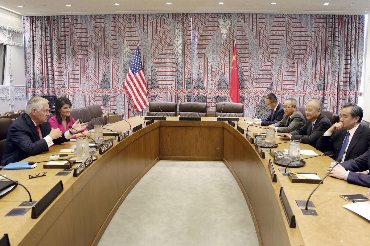 Secretary of State Rex Tillerson, left, accompanied by U.S. UN Ambassador Nikki Haley, and China